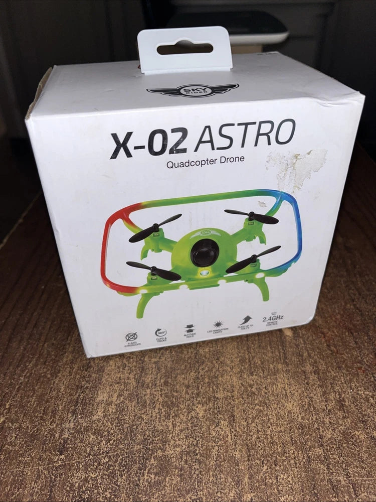 Green quadcopter drone with Wi-Fi camera on retail box