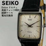 SEIKO Dolce quartz wristwatch with silver rectangular case, champagne dial, black leather strap