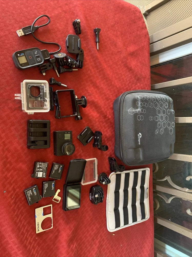 GoPro HERO4 action camera accessory set with mounts, cases, and battery