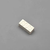 Mini rectangular battery pack with embossed circuit details, light beige