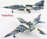 Diecast jet aircraft model in gray camouflage with red star markings, landing gear visible