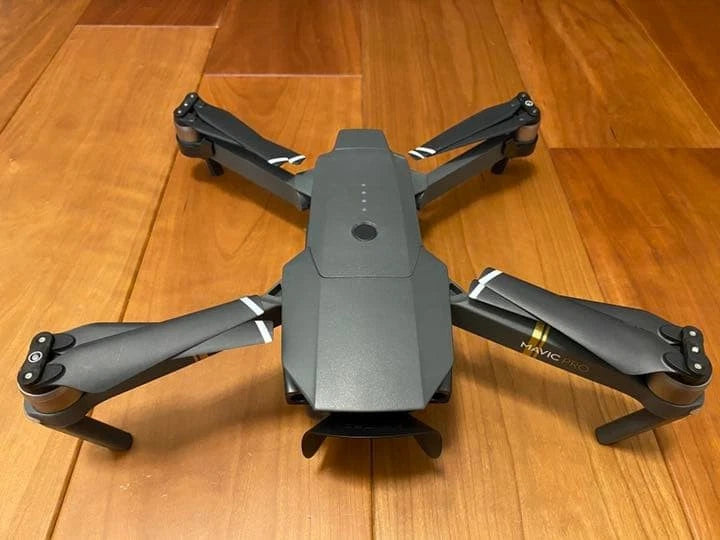 Dji Mavic Pro drone quadcopter with folded propellers, gray body, top view