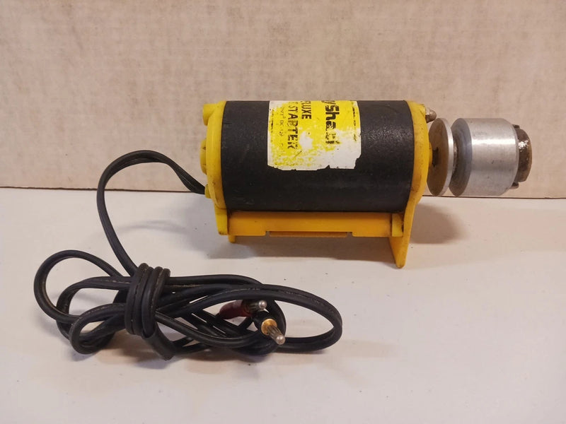 12V nitro gas airplane starter motor with yellow-and-black body and attached wiring