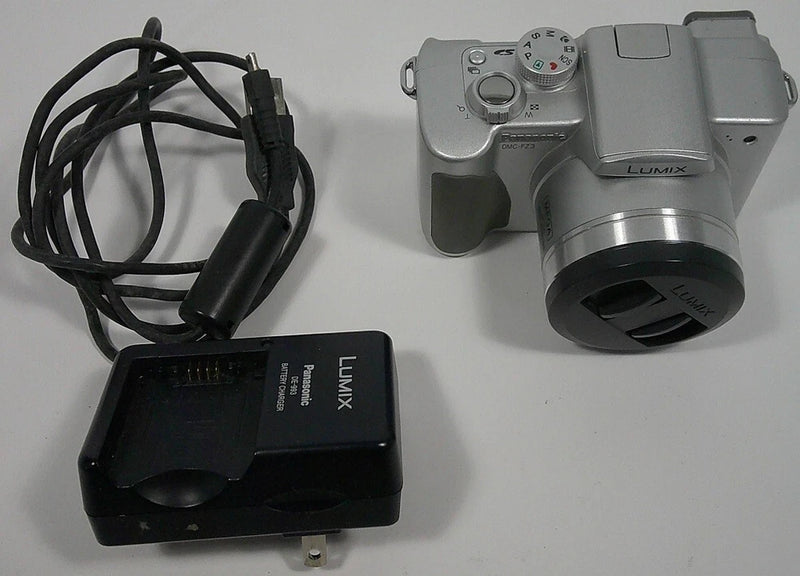 Panasonic LUMIX DMC-FZ3 digital camera with lens, charger base, and power cable