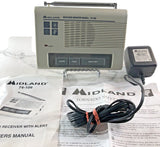 Weather alarm monitor with display, test/alert buttons, plus AC adapter and battery backup unit
