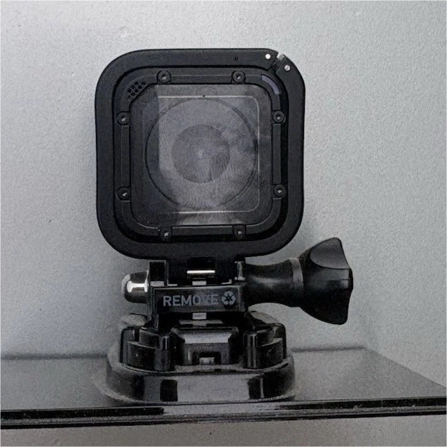 Black GoPro HERO 4 Session action camera in waterproof housing with mounting bracket
