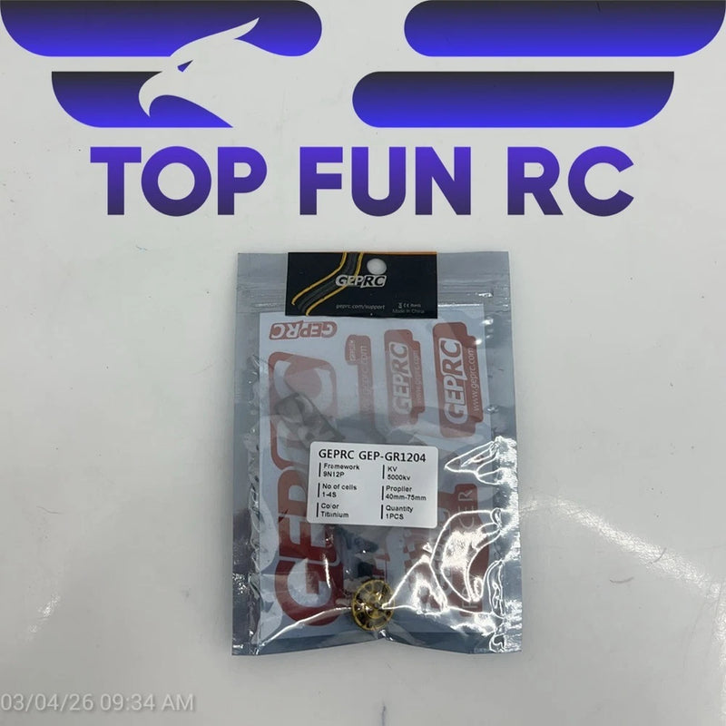 GEPRC titanium-colored RC drone motor in clear retail package, brass-colored shaft