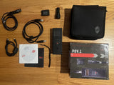 POV1 video camera kit: black camera, carrying case, cables, battery, instruction disc