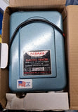 Parmak electric fencer controller, blue metal housing with label and power lead