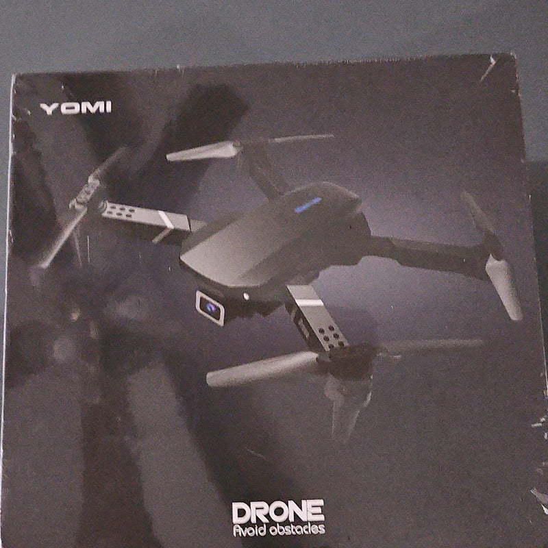 YOMI foldable quadcopter drone with camera, obstacle avoidance shown on box