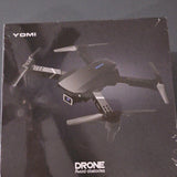 YOMI foldable quadcopter drone with camera, obstacle avoidance shown on box