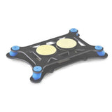 Black anti-vibration flight controller mount plate with four blue rubber feet