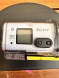 Sony action cam in clear waterproof housing with LCD screen and Wi‑Fi controls