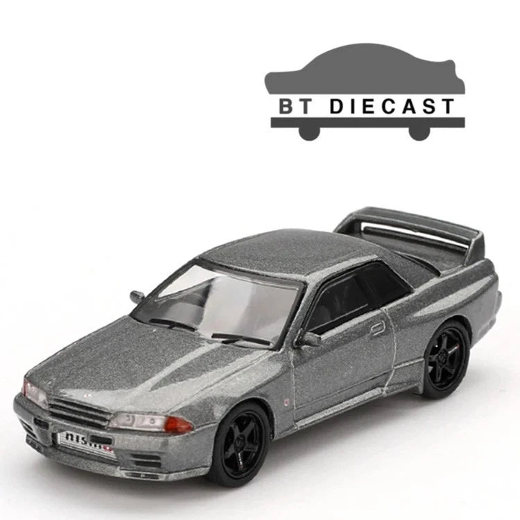Grey Nissan Skyline GT-R NISMO BNR32 die-cast model car with black wheels