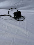 Go Pro Hero action camera with black mount and attached cable