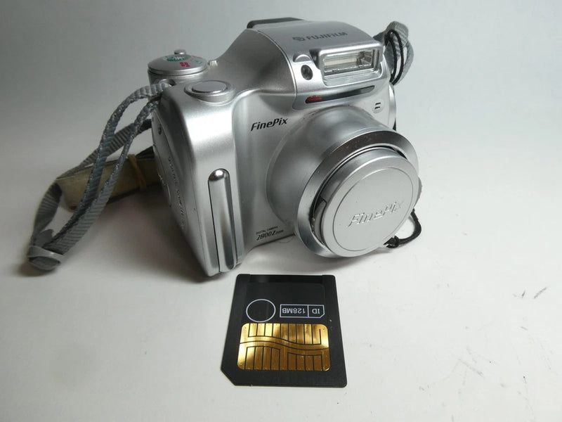 FujiFilm FinePix silver digital bridge camera with zoom lens and memory card