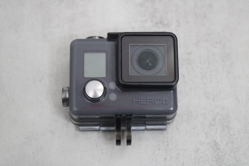 GoPro HERO+ action camera in waterproof housing with front lens and small LCD screen