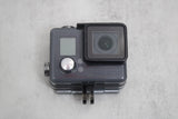 GoPro HERO+ action camera in waterproof housing with front lens and small LCD screen