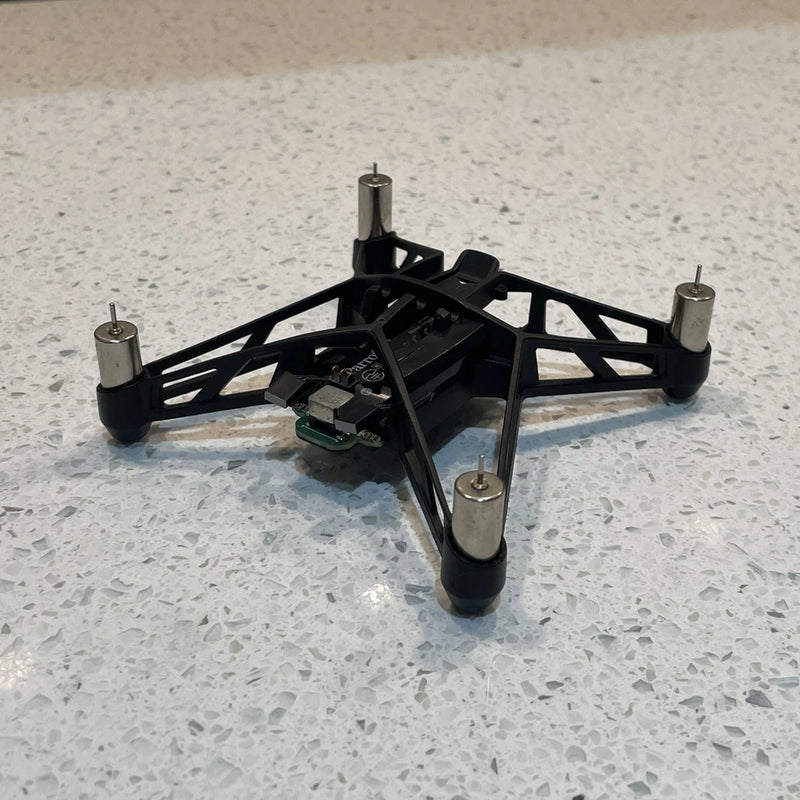 Black spider drone frame with four prop mounts and central body