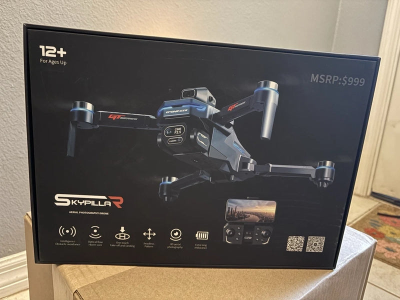 Photography drone box with illustrated quadcopter and handheld controller