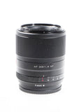 Black camera lens with ridged focus ring and front glass, marked AF 33/1.4 XF