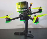 FPV racing drone stand with upright pole and tripod base holding a quadcopter