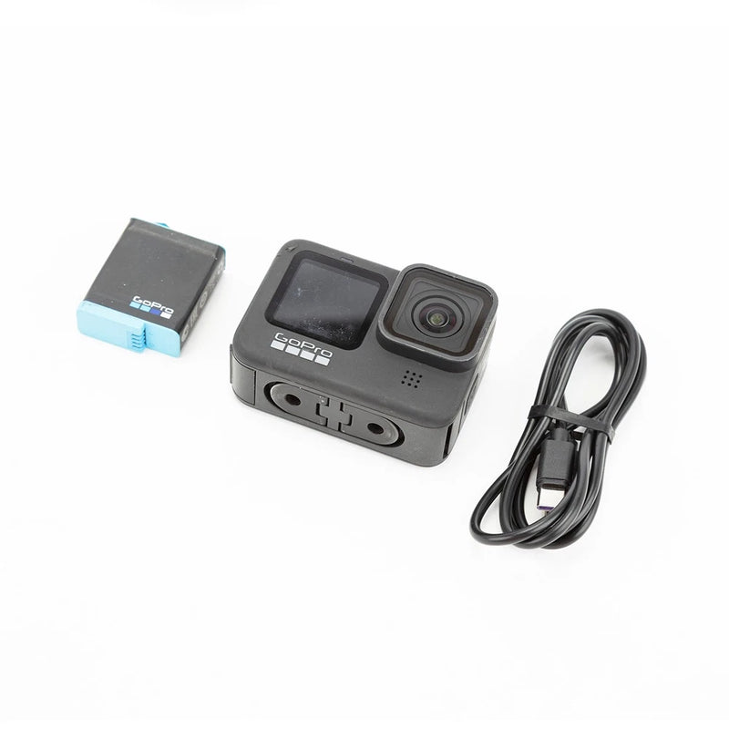 GoPro HERO9 Black action camera with front display, lens, and side ports; includes cable.