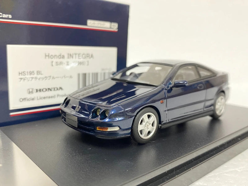 1:43 scale resin model car, blue and silver, front 3/4 view with detailed grille