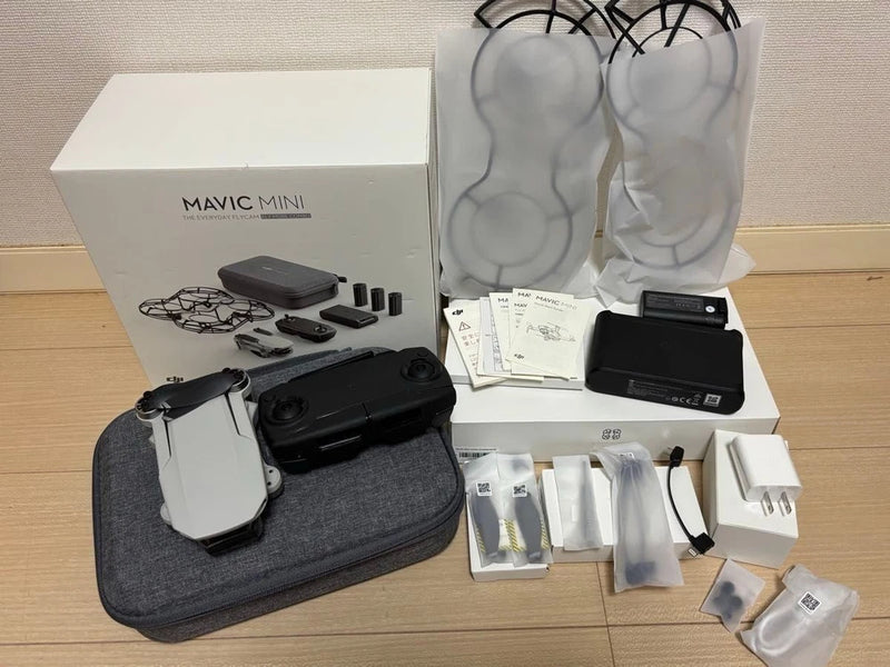DJI Mavic Mini drone kit with controller, batteries, and carry case