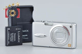 Silver Panasonic Lumix FX01 compact digital camera with lens and strap eyelet