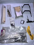 RC helicopter parts lot: black metal frame, screws, and components in sealed bags