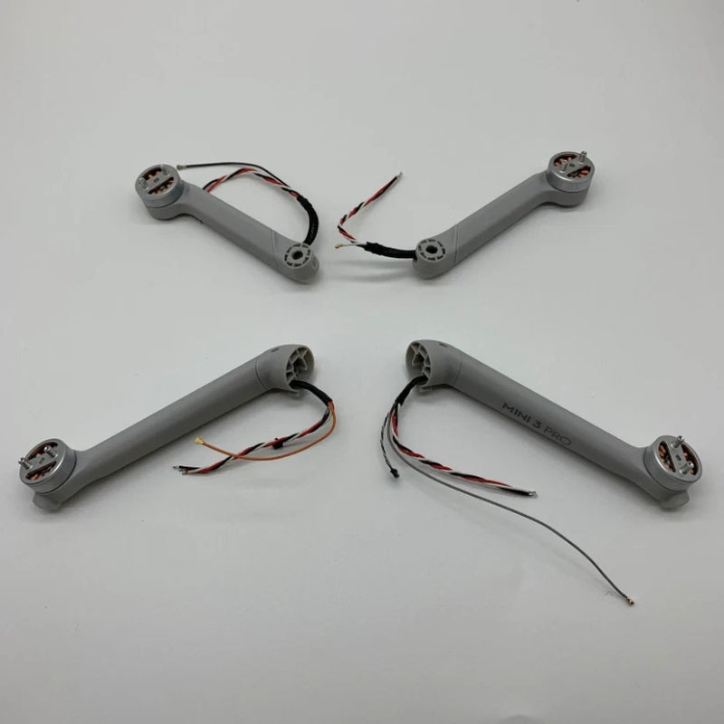 DJI Mini 3 Pro drone motor arm replacement set with gray arms and wiring leads