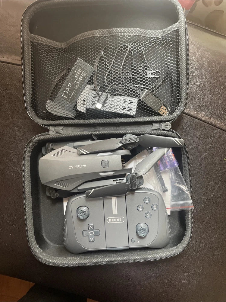 Dark grey foldable drone camera with controller in zip storage case
