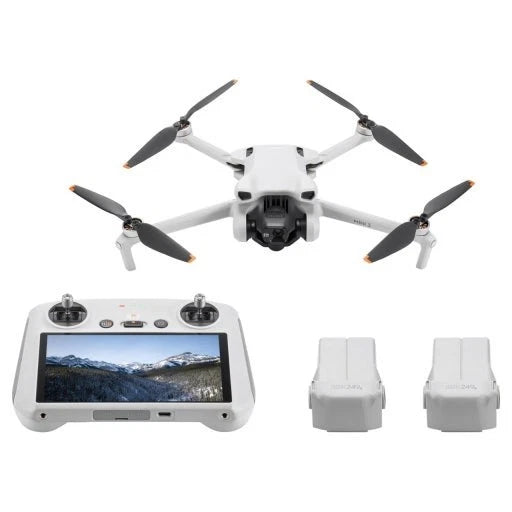 Quadcopter drone with remote controller screen and two white battery packs