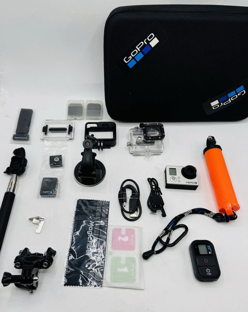 GoPro HERO3 Silver action camera kit with waterproof case, mounts, and remote