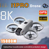 White quadcopter drone with 4 rotors, front camera, small screen on body.