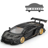 Matte black 1/64 die-cast sports car with gold wheels and rear spoiler