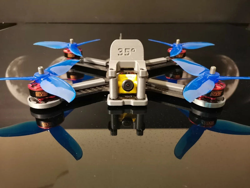 Lowrider freestyle quadcopter drone with blue propellers and front camera pod