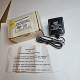 RC battery charger with black power unit, attached cable, and instruction sheet