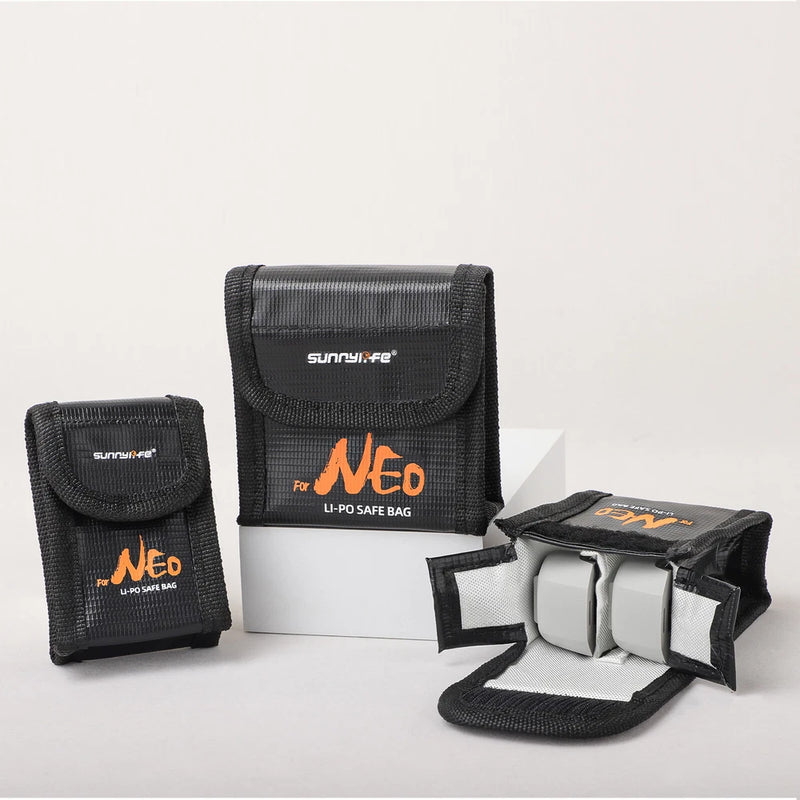 Black nylon battery storage case with flap, modular inserts and open compartment