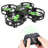Mini quadcopter drone with LED lights, green accents and hand controller.