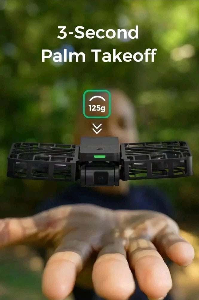 Black pocket drone held in hands, front camera visible