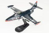 1/48 scale model jet aircraft on display stand, dark navy with white US Navy markings