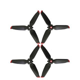 Drone propeller spare parts: four black blades with red tips
