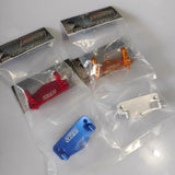 CNC alloy steering servo mount set with orange, blue, red, and silver mounts in bags