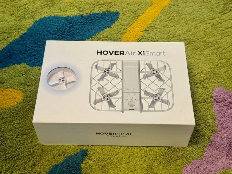 Foldable pocket smart drone box with front panel and drone diagram