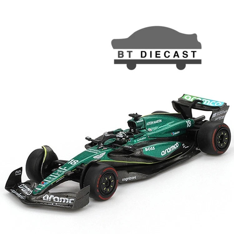 Green and black 1/64 die-cast F1 race car model with #18 on the nose