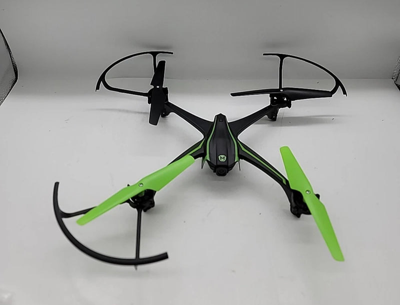 Green and black quadcopter stunt drone with four propellers, compact body