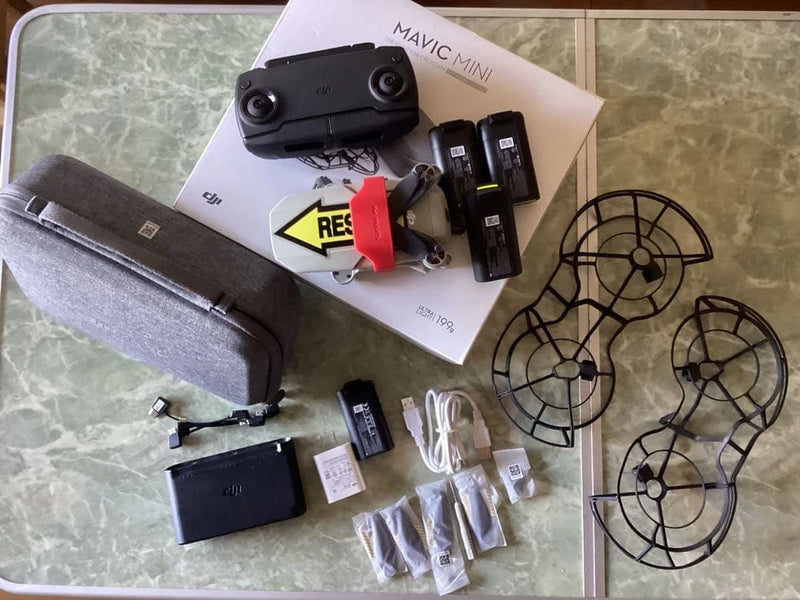 DJI Mavic Mini drone kit with remote, batteries, charger, propellers and accessories