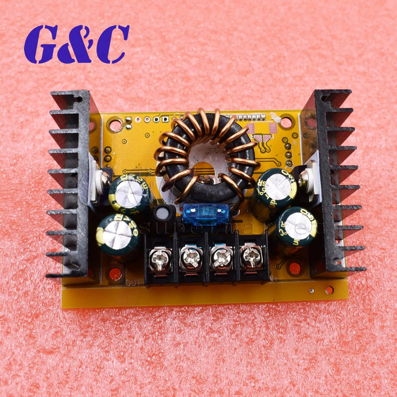 DC-DC step-up module PCB with heatsinks, capacitors, and terminal block